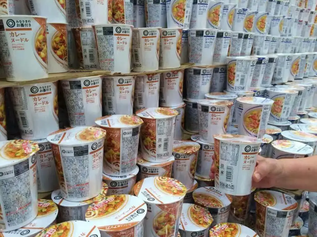 Ramen in cups on a shelf