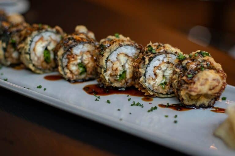A sushi roll with chicken in soy sauce