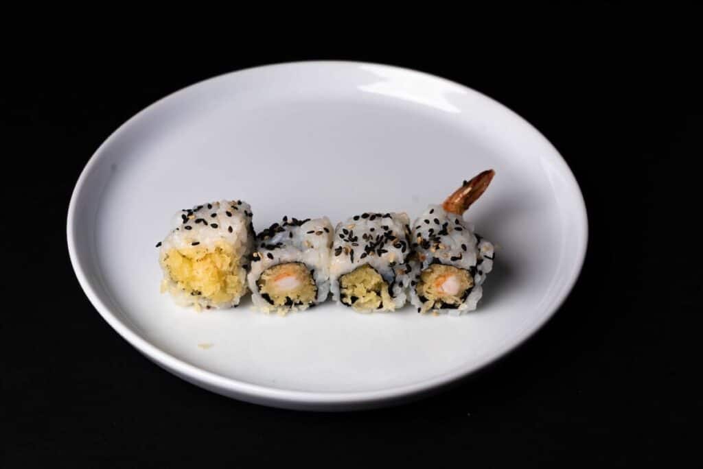 California rolls on a white ceramic plate