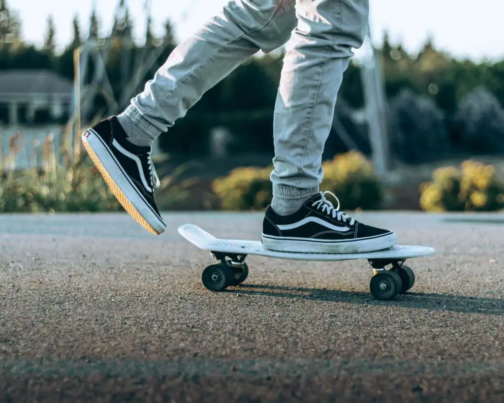 A skater off-screen wearing Vans Old Skool sneakers
