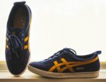 A blue and yellow pair of Onitsuka Tiger sneakers