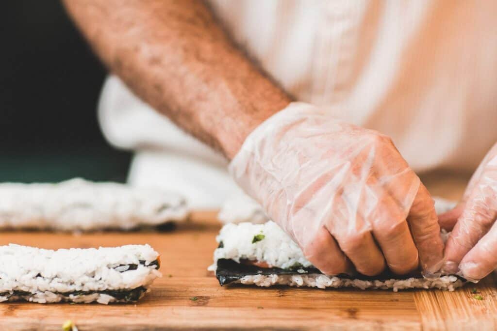 A man making sushi rolls