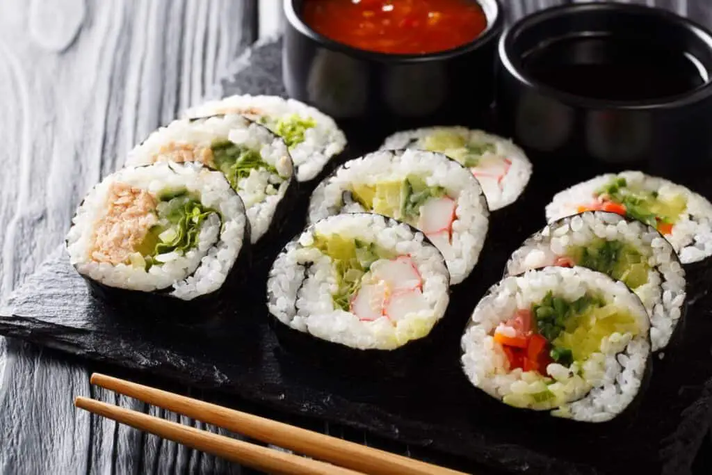 Maki sushi served with sauces