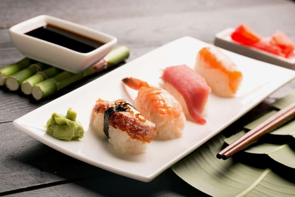 Sushi served with soy sauce and wasabi