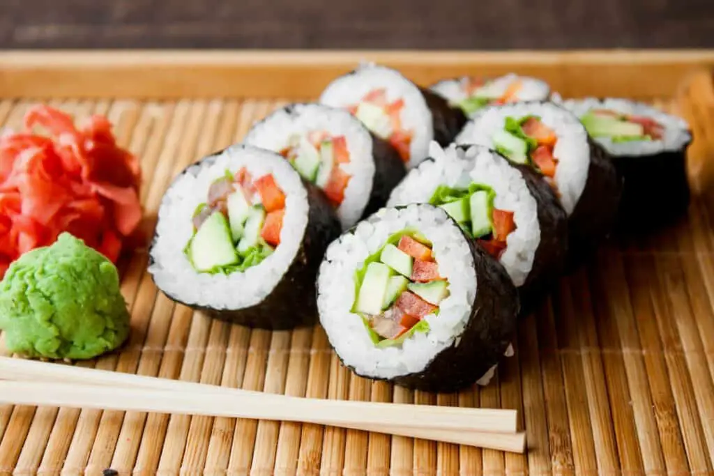 Maki sushi rolls served with wasabi and ginger
