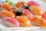 Nigiri sushi made with tuna, salmon, and eel