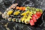 Sushi rolls on a board