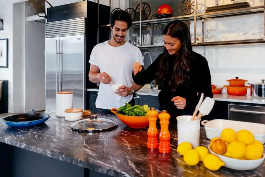 Couple making sashimi salad