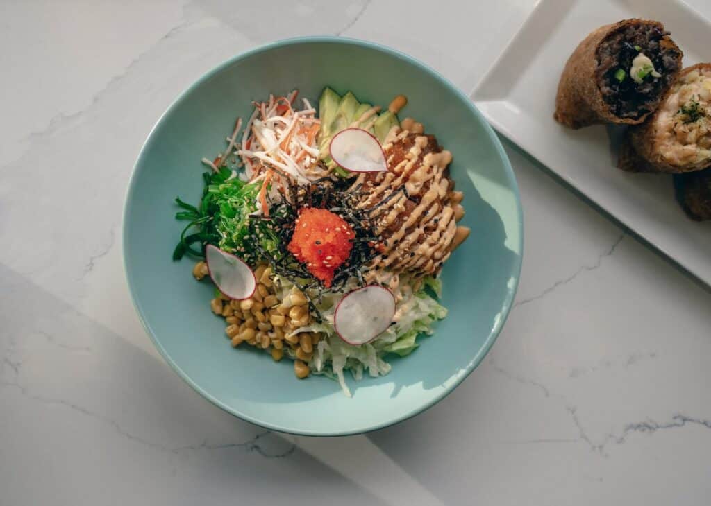 Sashimi salad on a blue plate