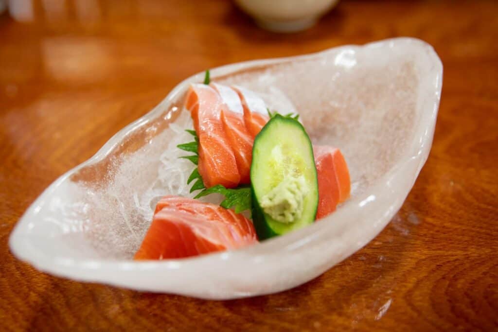 Salmon sashimi in a glass bowl
