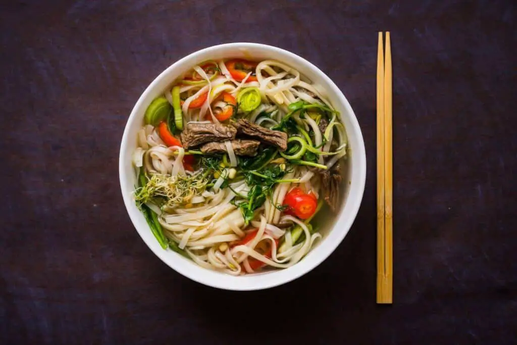 A bowl of ramen with rice noodles