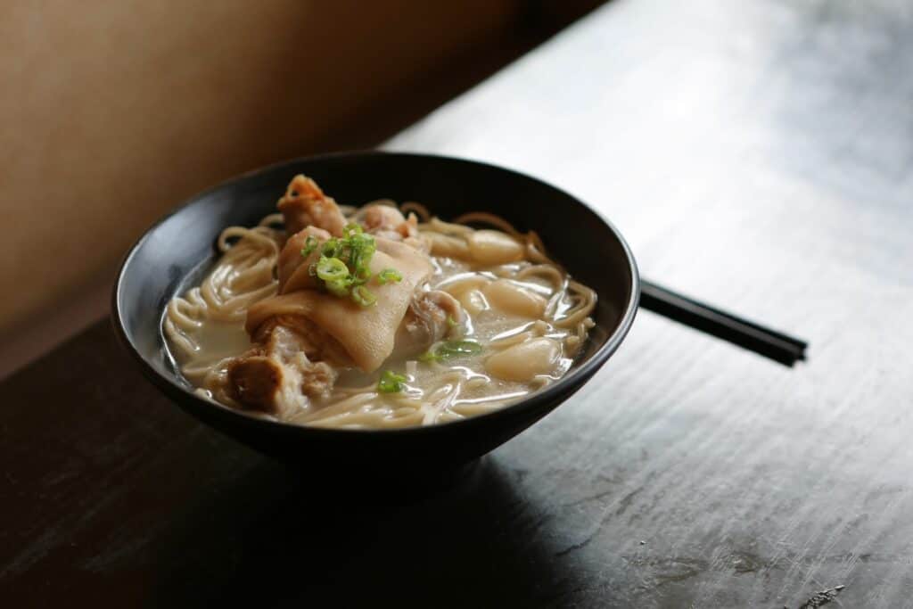 Cloudy and thick tonkotsu ramen in a ceramic bowl