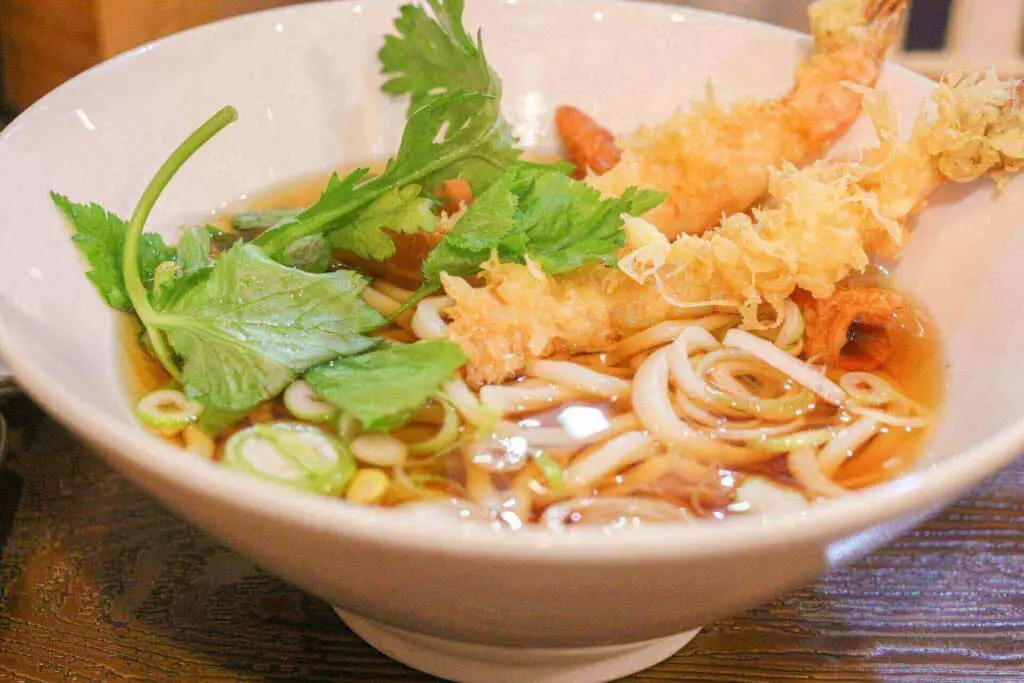 Shrimp tempura in a bowl of noodles 